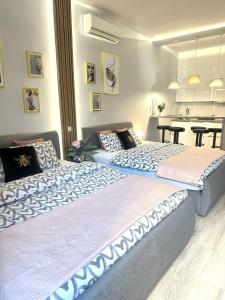Posteľ alebo postele v izbe v ubytovaní Exclusive Apartments Smolna