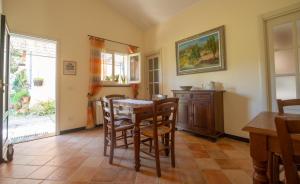 a dining room with a table and chairs at Agriturismo Villa Caterina in Levanto