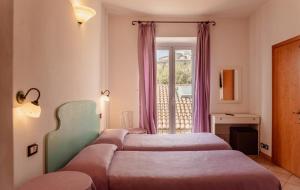 Postel nebo postele na pokoji v ubytování Hotel Rossi