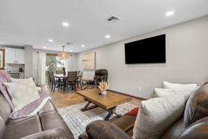 a living room with a couch and a table at 29 - Modern 5 Bedroom 2 Bath in Middletown