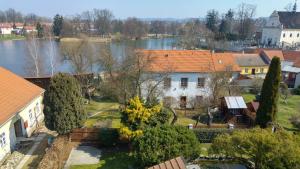 an aerial view of a house with a lake at B&B Nika in Telč