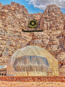 a large tent in front of a rocky mountain at RUM W BUBBLE lUXURY CAMP in Wadi Rum +24 photos