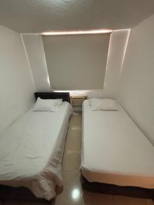 Ένα ή περισσότερα κρεβάτια σε δωμάτιο στο Comfortable and Relaxing Apartment