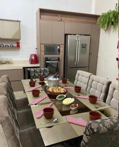 a kitchen with a table with food on it at Hostel Amor por SP - Brás - Expo Center Norte - Feira da Madrugada in São Paulo