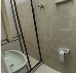 a bathroom with a shower with a toilet and a sink at La casa de la abuela in Jericó +10 photos