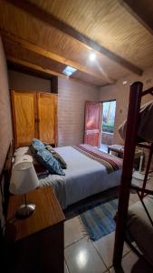 Postel nebo postele na pokoji v ubytování Hostal Hara