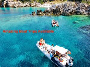 a group of people on a boat in the water at SEA SIDE FAMILY APARTMENTs in Vlorë