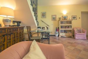 a living room with a couch and a table at Agriturismo Villa Caterina in Levanto