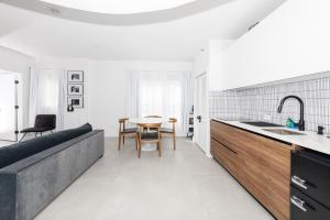 a kitchen with a couch and a table in a room at Bellio in Sobe in Miami Beach