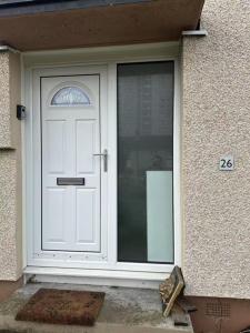 a white door of a house with the number at Double room in 3 bedroom house in Edinburgh