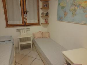 Postel nebo postele na pokoji v ubytování Casa dei glicini