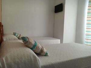 Postel nebo postele na pokoji v ubytování Hostal Barbate
