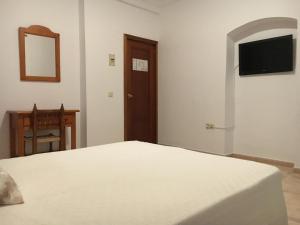 Postel nebo postele na pokoji v ubytování Hostal Barbate