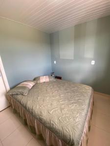 a bedroom with a bed in a room at Pousada Pôr do Sol in Lapa