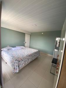 a bedroom with a bed in a room at Pousada Pôr do Sol in Lapa
