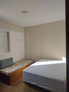 Postel nebo postele na pokoji v ubytování Apartamento Enseada