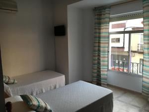 Postel nebo postele na pokoji v ubytování Hostal Barbate