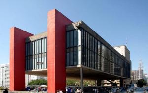 a red and black building in a city at São Paulo Flat Familia ExtraComfort TV 65" lado Sírio Libanes in Sao Paulo