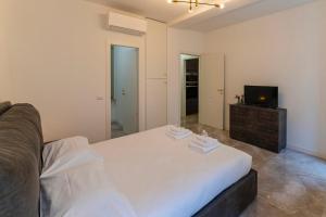 Postelja oz. postelje v sobi nastanitve Magic Place Bergamo! Classy Apartment in the heart of the city