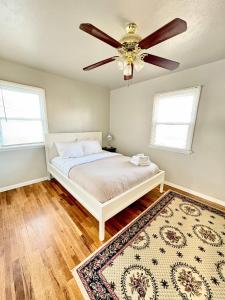 a bedroom with a bed and a ceiling fan at Historic 2 bedroom home in Old Town-main floor in Pocatello +2 photos
