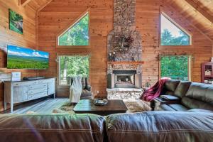 a living room with a couch and a fireplace at Sweet Retreat in Townsend