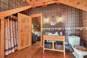 a bathroom with a sink and a toilet at Sweet Retreat in Townsend +34 photos