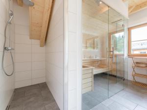 a bathroom with a shower and a glass shower stall at Haus Rapunzel in Donnersbachwald +23 photos
