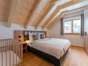 Posteľ alebo postele v izbe v ubytovaní Haus Enzian