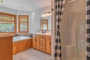 a bathroom with a tub and a sink and a shower at Mountain Peace in Townsend +54 photos