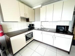 A kitchen or kitchenette at Studio in Middelkerke with Pool and Sea View