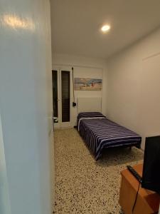 Posteľ alebo postele v izbe v ubytovaní Playa Cambrils Salou B
