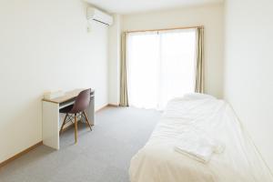 Postel nebo postele na pokoji v ubytování Hotel Morimotoya 板野店