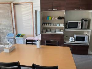 Kuchyň nebo kuchyňský kout v ubytování Hotel Morimotoya 板野店