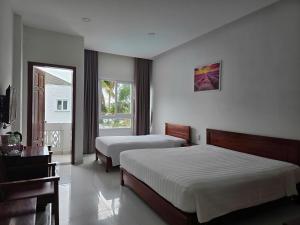 Postel nebo postele na pokoji v ubytování Lavender Resorts Phu Quoc + 48 fotografií