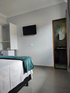 TV a/nebo společenská místnost v ubytování Pousada Aliança