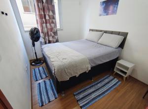 Giường trong phòng chung tại Apartamento Tranquilidade!