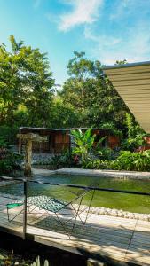 a view of a tennis court in a yard at Gulungos Refugio Natural in Cisneros +58 photos
