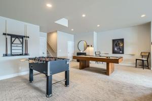 a room with a ping pong table and a pool table at Deer Valley Mountain Luxury at Jordanelle! 893 townhouse in Heber City