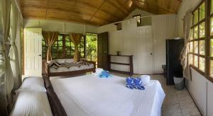 Ένα ή περισσότερα κρεβάτια σε δωμάτιο στο Susan Bungalow #4