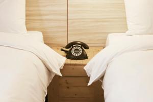 Postel nebo postele na pokoji v ubytování Pinestone Inn