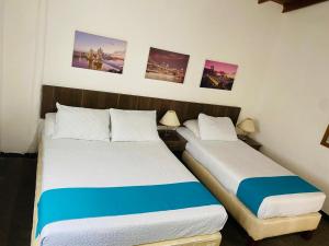 Postel nebo postele na pokoji v ubytování Hotel del Parque Confort LaCeja