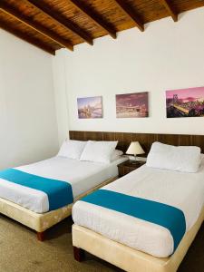 Postel nebo postele na pokoji v ubytování Hotel del Parque Confort LaCeja