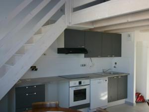 a kitchen with a sink and a staircase at Appartement à Noirmoutier 4 personnes avec parking - FR-1-823-31 in Noirmoutier-en-l'lle