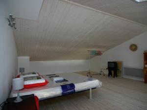a large room with a bed in a attic at Appartement à Noirmoutier 4 personnes avec parking - FR-1-823-31 in Noirmoutier-en-l'lle