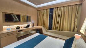 Hotel Central Tree客房内的一张或多张床位