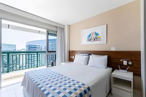 a bedroom with a bed and a large window at Hotel VISION in Brasilia +150 photos