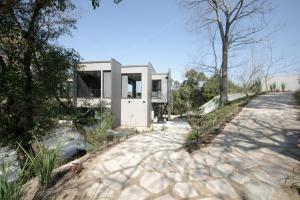 a house on a hill with a walkway at KITOW private villa in Awaji