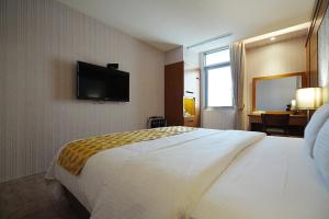 Postel nebo postele na pokoji v ubytování York Hotel