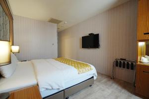 Postel nebo postele na pokoji v ubytování York Hotel