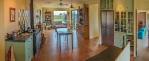 a large room with a kitchen and a living room at AislingQuoy in Amberley